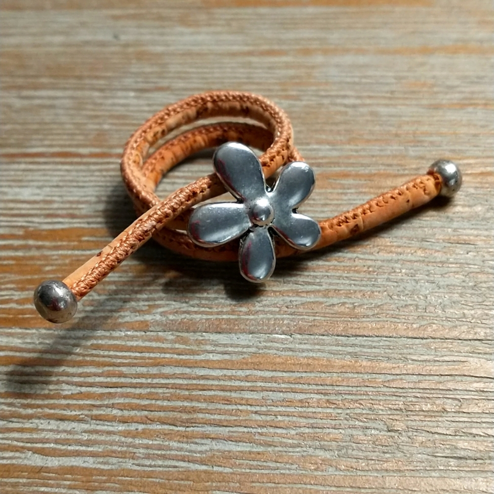Unique Ring made of Leather-like material and silver tone flower.